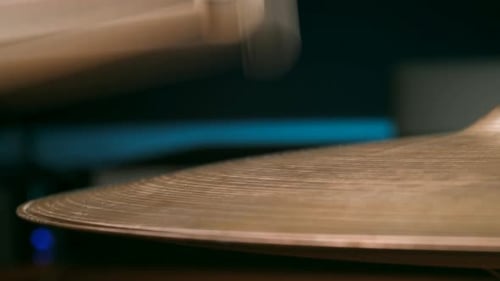 Drummer Playing Hi Hat Cymbal with Drumsticks in a Recording Studio