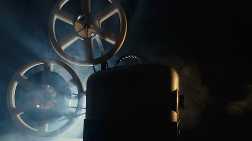 Vintage Film Projector with Smoke in Dark Room