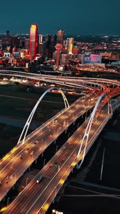 Cityscape of Dallas at Night with Illuminated Skyscrapers and Highways