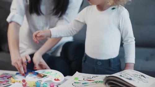 Portrait Mother with Little Daughter Painting Paper Together Smiling Kid Family Hobby Baby Design