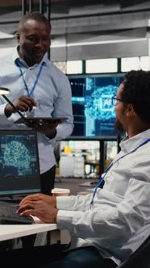 Vertical Video Smiling Programmers Working in AI Startup Train Predictive Models