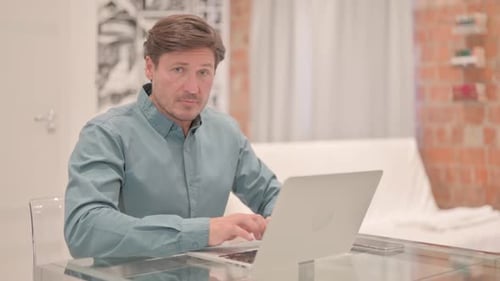 Man Working on Laptop Says No