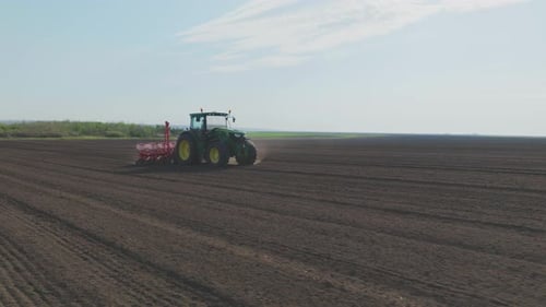 Tractor moving on agricultural field