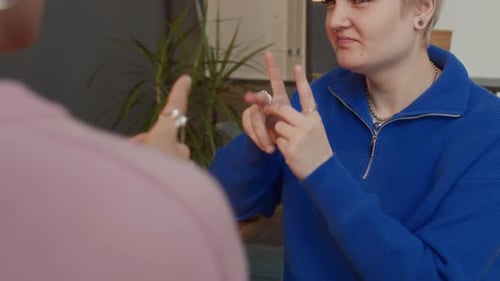 Young Adult Communicating With Sign Language