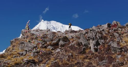 Nepal Drone Reveal: Male Climber Summits Langtang with Everest in View