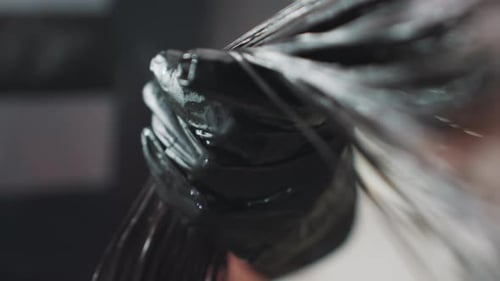 Hair Dye Application Hands Covered in Gloves Applying Dye to Hair Detailed Image Capturing