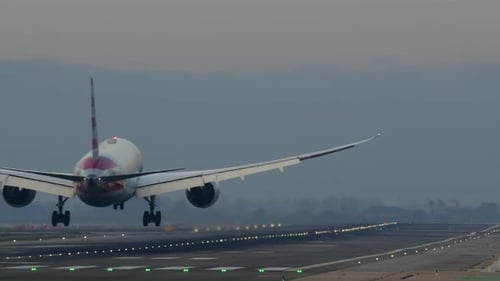 Airplane Landed on Illuminated Runway