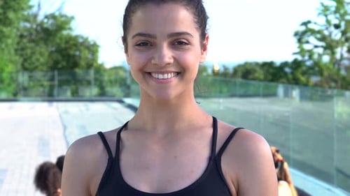 Smiling Woman in Athletic Wear Outdoor Urban Setting