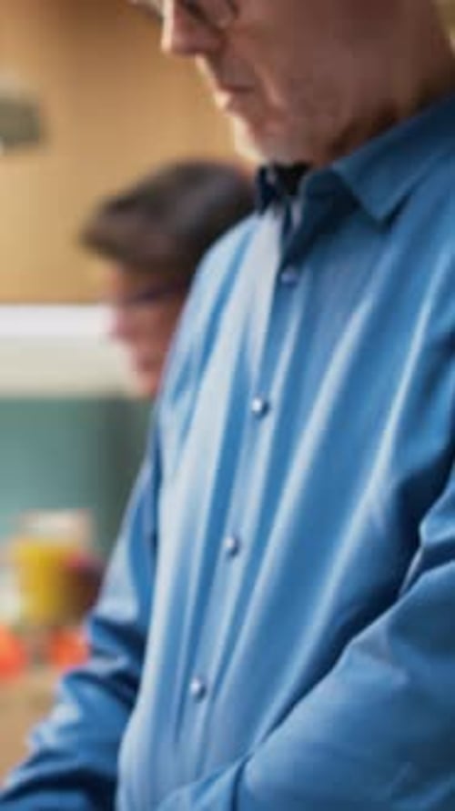 Senior Man Working on Laptop at Home