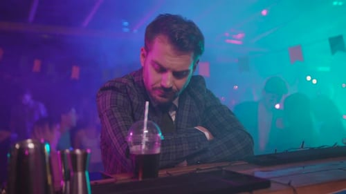 DJ Exhaustion at a Vibrant Party Scene Where Energy Meets Color and Community Thrives