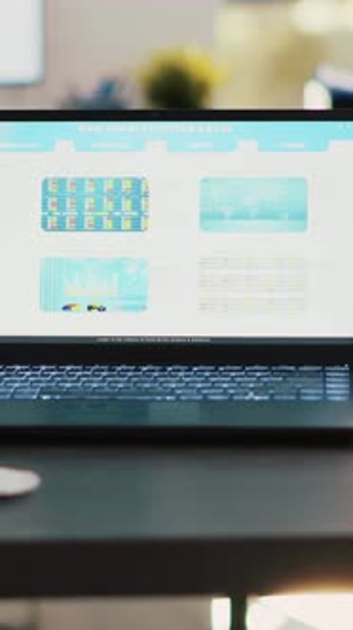 Vertical Video Stock Market Diagrams with Charts and Stock Figures on Laptop Sitting on Desk