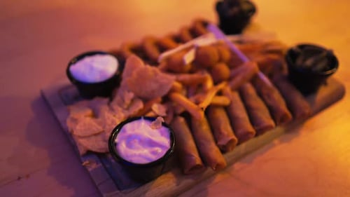 Close Up of Appetizing Snack Board with Fried Foods