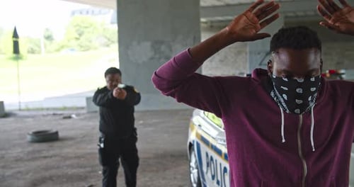 Man Apprehended by Law Enforcement Officer with Handgun