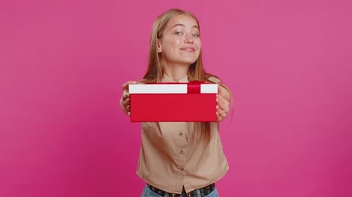 Young Woman Presents a Gift in Studio