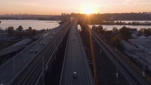 Evening Cityscape with Highway Bridge Over the River