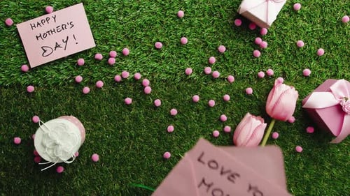 Colorful Mother's Day Gifts and Flowers on Green