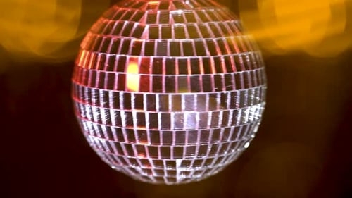 Rotating Disco Ball Reflecting Colorful Lights