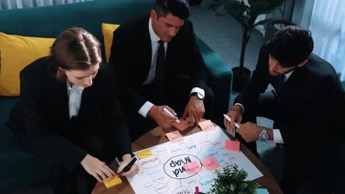 Team Brainstorming Business Ideas Together in Office