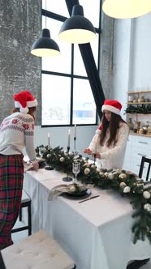 Two Female Friends Decorate the New Year's Table