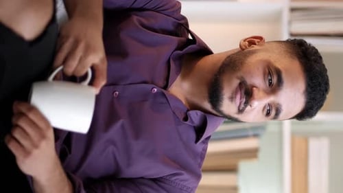 Man Drinking Coffee at Home