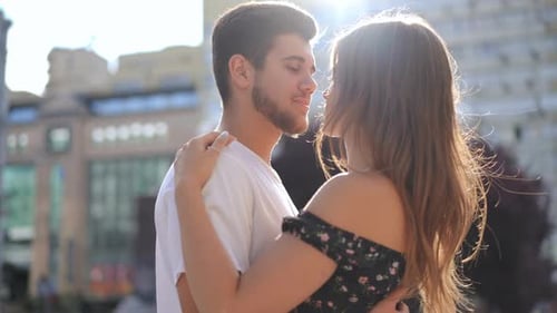 Live Camera Panning Around Loving Hugging Millennial Happy Couple Standing on City Street in