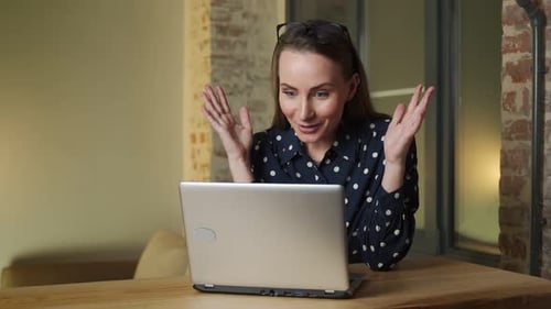 Young Woman in a State of Euphoria Celebrates a Victory or Receives an Offer to Buy in Ecommerce on