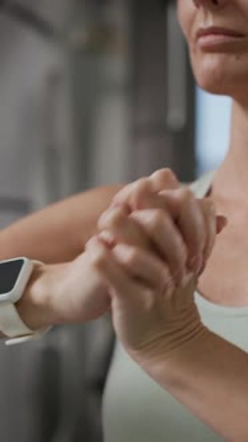 Adult Woman Checking Fitness Smartwatch at Indoor Gym
