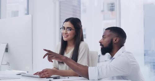 4k video footage of two businesspeople working together in an office