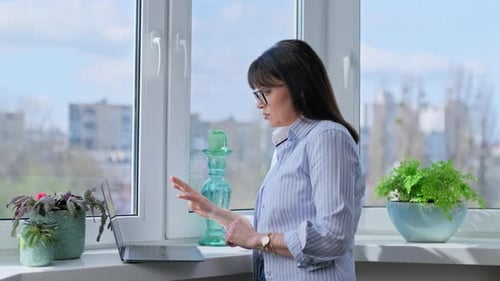 Woman Having Video Call on Laptop at Home