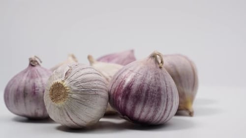 Rotating garlic on a white background.