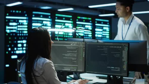 Computer Scientist Monitors Cybersecurity Risks in Server Room