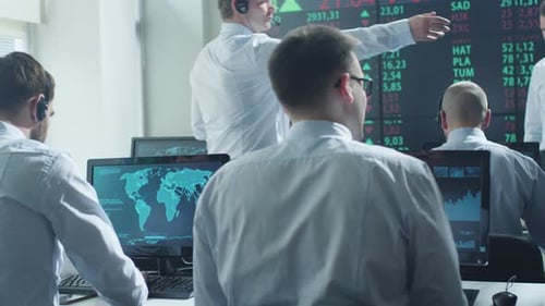 Busy Employees Working in Modern Stock Trading Office
