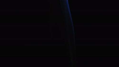 Abstract blue color smoke with a black background in slow motion. Realistic cloud smoke with a strea