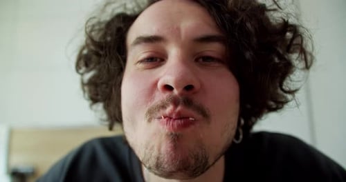 Young Adult Eating a Delicious Sandwich Close-Up