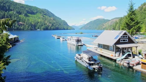 Pleasure Boat Navigating Next to Marina Quay on Beautiful Summer Day in Port Alberni Region, British