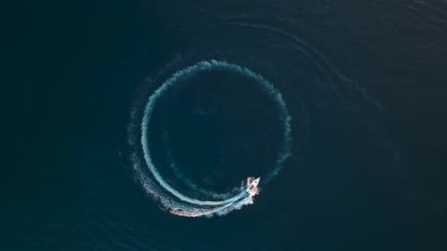 Aerial View of Boat Making Circle in Ocean