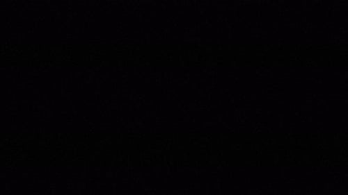 Film Noise on Analog TV Screen VHS, Dust and Grain on Old Damaged Filmstrip Surface. 4K Video Retro