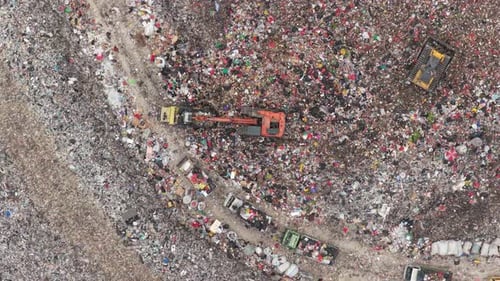 Aerial View of Landfill with Waste and Bulldozers