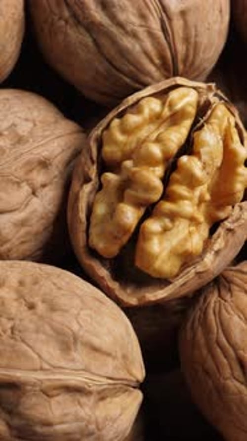 Whole Walnut Closeup Rotating Nuts Background Vertical Footage