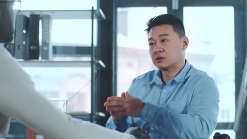 Business Professionals Discussing Strategy in Modern Office