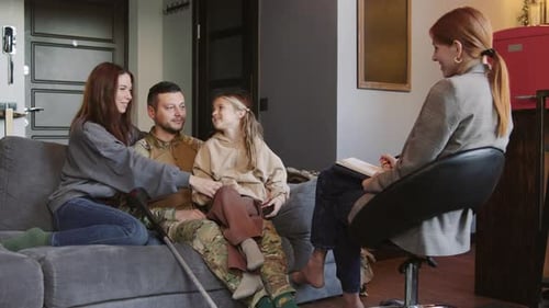 Family Consults with Therapist in Comfortable Home Setting
