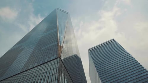 Modern glass building in the city. Facade of building structure. Corporate glass building facade on