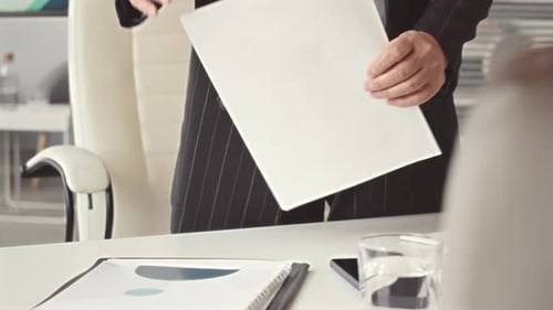 Woman Presenting Bar Graph Data in Office