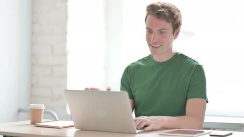 Online Video Chat By Young Man at Work