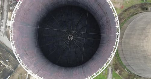 Aerial of Santa Barbara power station cooling tower. Cloudy day, Winter season. Cavriglia, San Giova