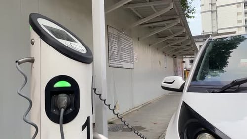 Electric car charging station and electric car in Singapore. Close up shot
