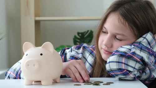 Child Girl Save Money By Putting Coins Into Piggy Bank Financial Planning