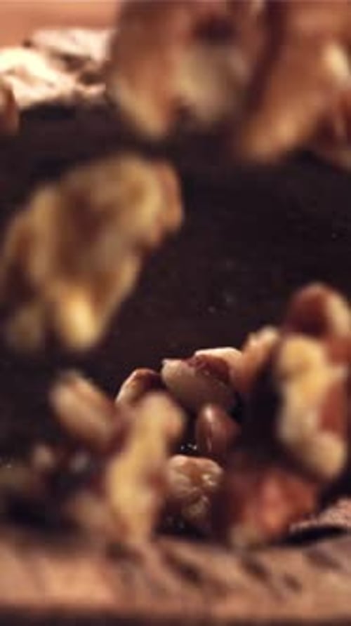 Walnuts Fall Into a Wooden Bowl Filmed on a Highspeed Camera at 1000 Fps