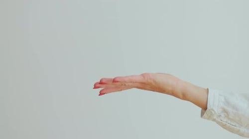 Close Up of Male Hand Passing Key to Female in New Apartament
