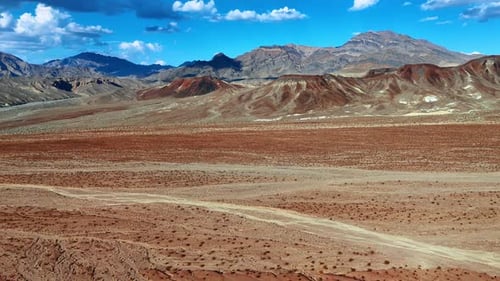 Footage over the desert covered with multiple shrubs.